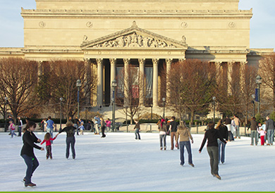 Families skating on the Sculpture Garden ice rink beside the cafe